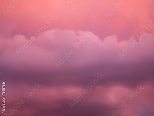 Detail of redish and violet clouds on evening sky photo