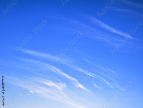 White clouds on bright blue sky, high stratospheric light white heaven