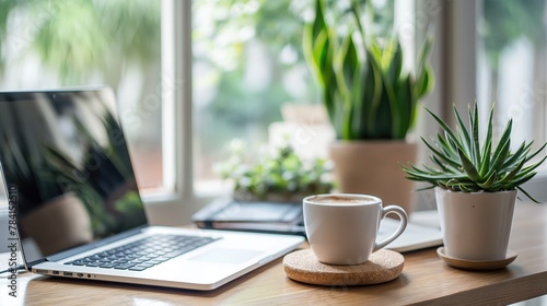 A stylish home office setup with a laptop, notebook, coffee cup, and potted plant, bathed in natural light from a nearby window, symbolizing the growing trend of remote work and freelancing