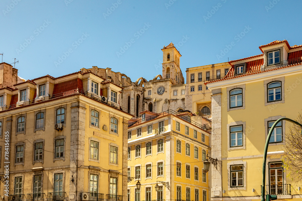 Golden Yellow Buildings of Lisbon, Architecture Stepping up the Steep Hillsides, Portugal on a Sunny Spring Day