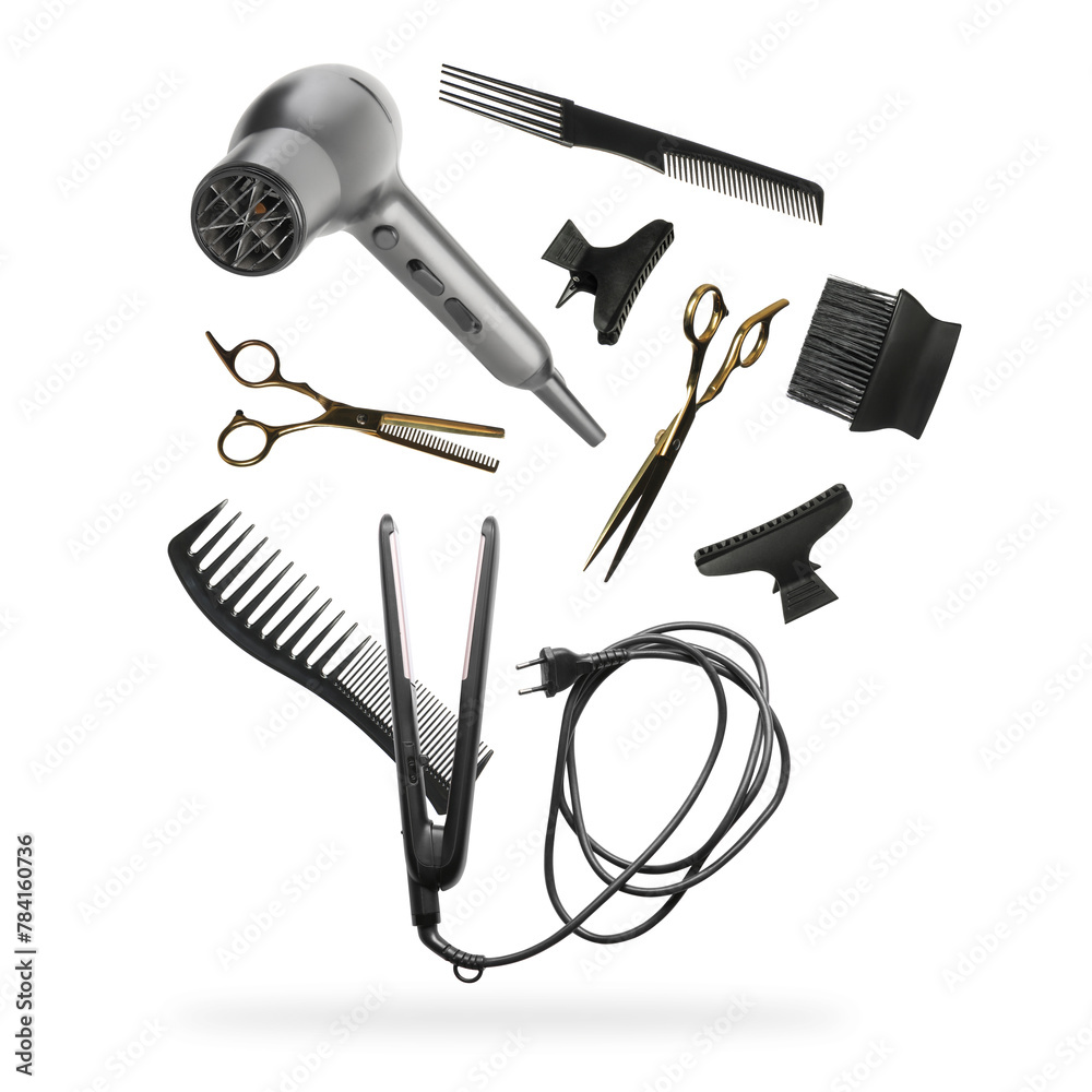 Professional hairdresser tools falling on white background - obrazy, fototapety, plakaty 