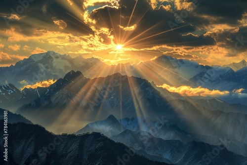 A beautiful sunrise over the mountains with sun rays shining through clouds