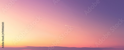 Ultrawide gradient sky sunset with very faint shooting star in the center of the frame  background image