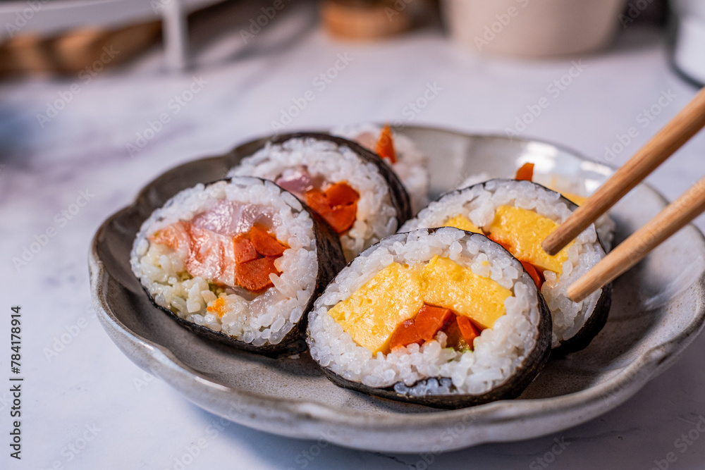 Close up sushi cut and chopsticks . Japanese food cooking and eating concept. healthy diet. Close up sushi cut and chopsticks . Japanese food cooking and eating concept. healthy diet.
