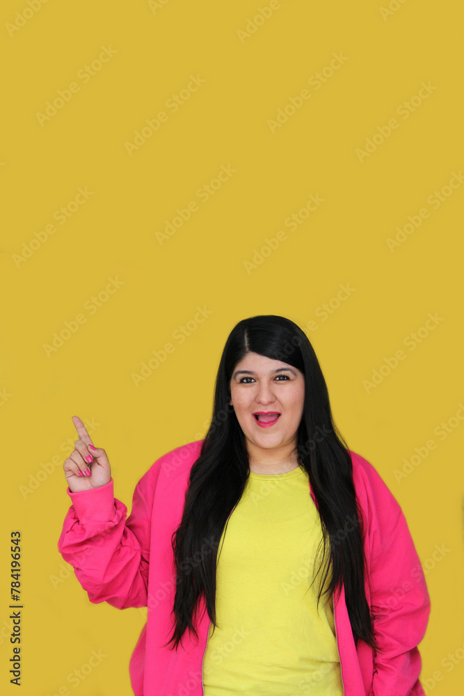Excited and happy 30-year-old Latin woman shows and points with her hands to promotions and discounts Excited and happy 30-year-old Latin woman shows and points with her hands to promotions and discounts