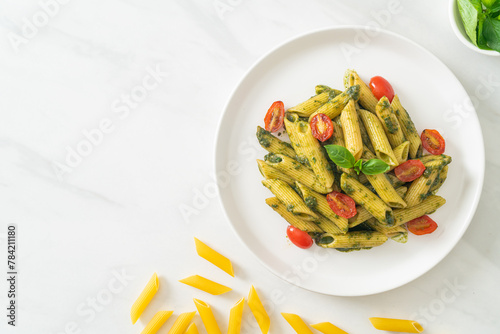 penne pasta with pesto sauce and tomatoes