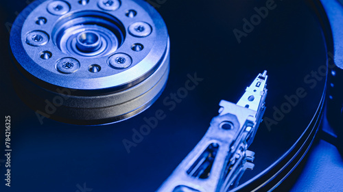 hard disk drive. computer digital data storage device. blue toned image.
