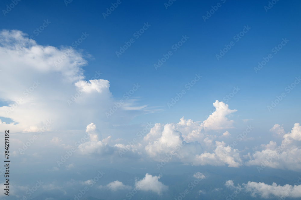 Aerial view clouds and blue sky from airplane window Aerial view clouds and blue sky from airplane window