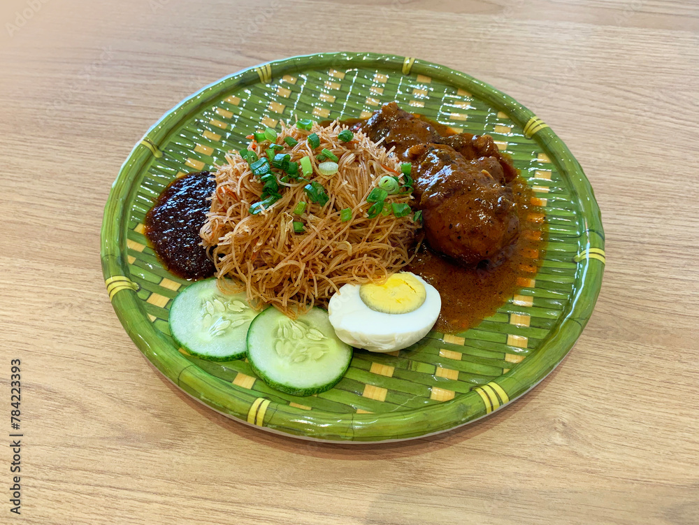 traditional peranakan wok fried nonya mee siam noodle spicy chilli shrimp paste w chicken rendang curry egg sambal cucumber in bamboo plate asian cafe hotel luxury halal food restaurant banquet menu