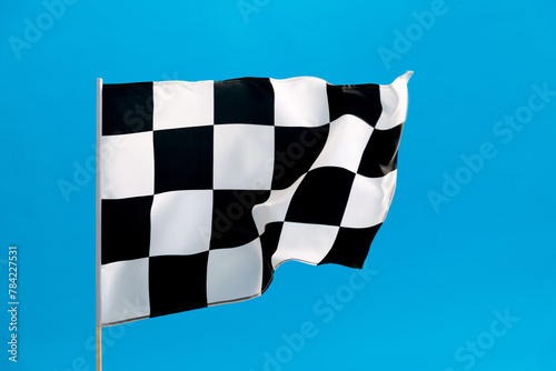 Checkered flag waving on blue background © xy