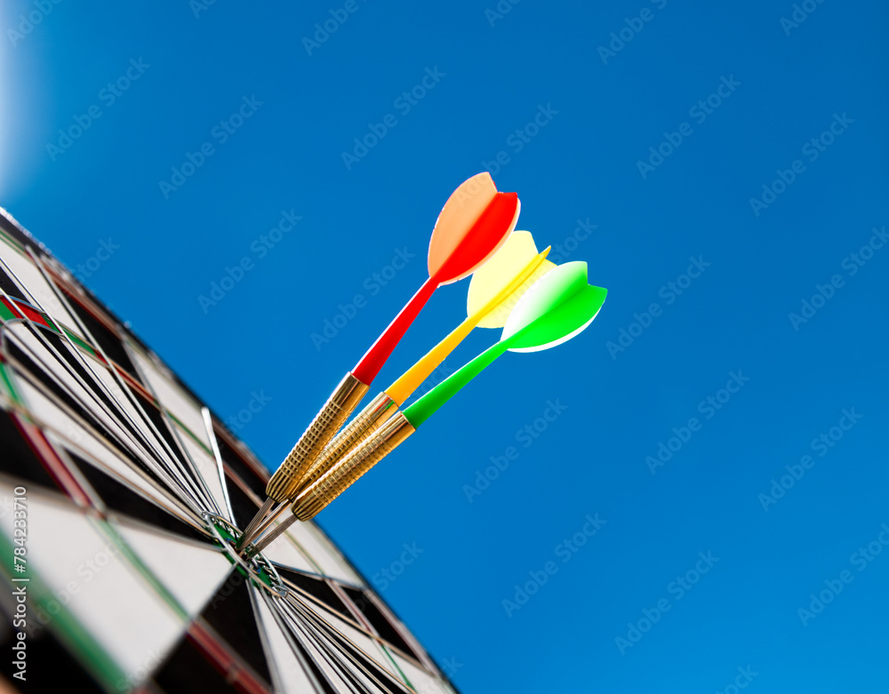 Three darts hitting on center target