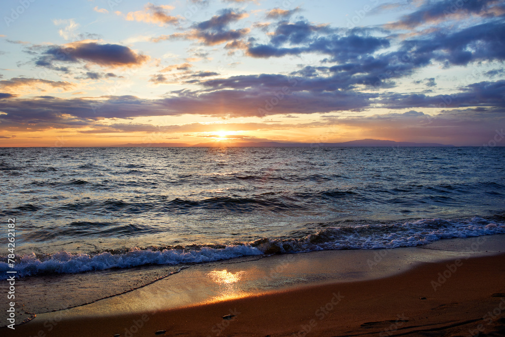 Fototapeta premium Beautiful summer sunset on the sea. Sandy beach.