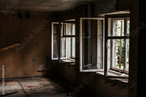 Old abandoned building. Old windows. Abandoned hotel. Peeling walls of the room. Horror concept.