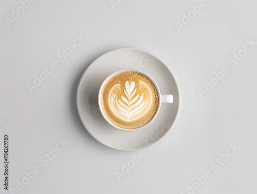 Photo of coffee cup from above with beautiful pattern. White background