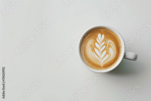 Photo of coffee cup from above with beautiful pattern. White background