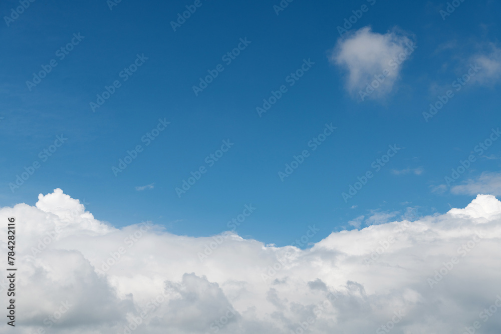 Naklejka premium White clouds on clear sky