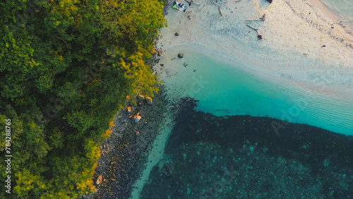Fototapeta Naklejka Na Ścianę i Meble -  Aerial View of a Beautiful Tropical Beach with Turquoise Water and White Sand