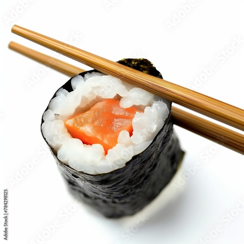 Close-up of a sushi roll held by chopsticks against a white backdrop, highlighting fresh ingredients.