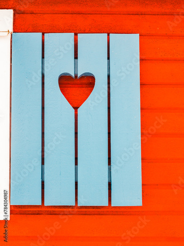 Blue Window Shutters With Heart Cutouts on a Swedish House