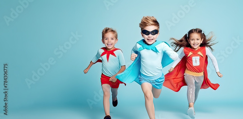 Group of children in colorful superhero costumes outfits having fun and grimacing ,a Children day