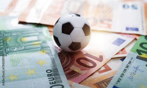 Soccer ball on stack of euro