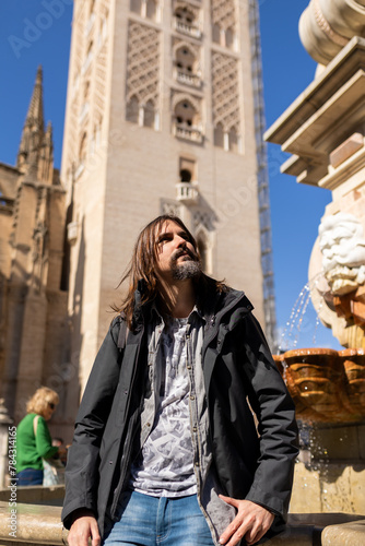 Tourist on vacation next to the Cathedral of seville, Andalucia, Spain