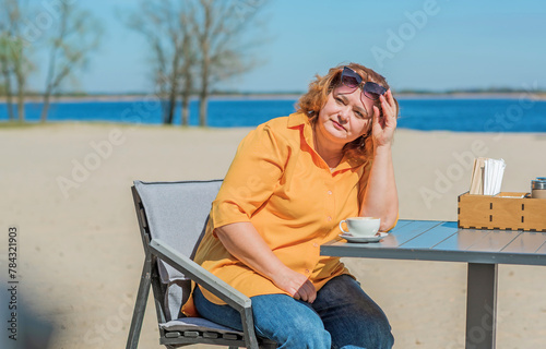  Overthinned middle aged woman thinking about something, crisis of middle age and problems among overweight people