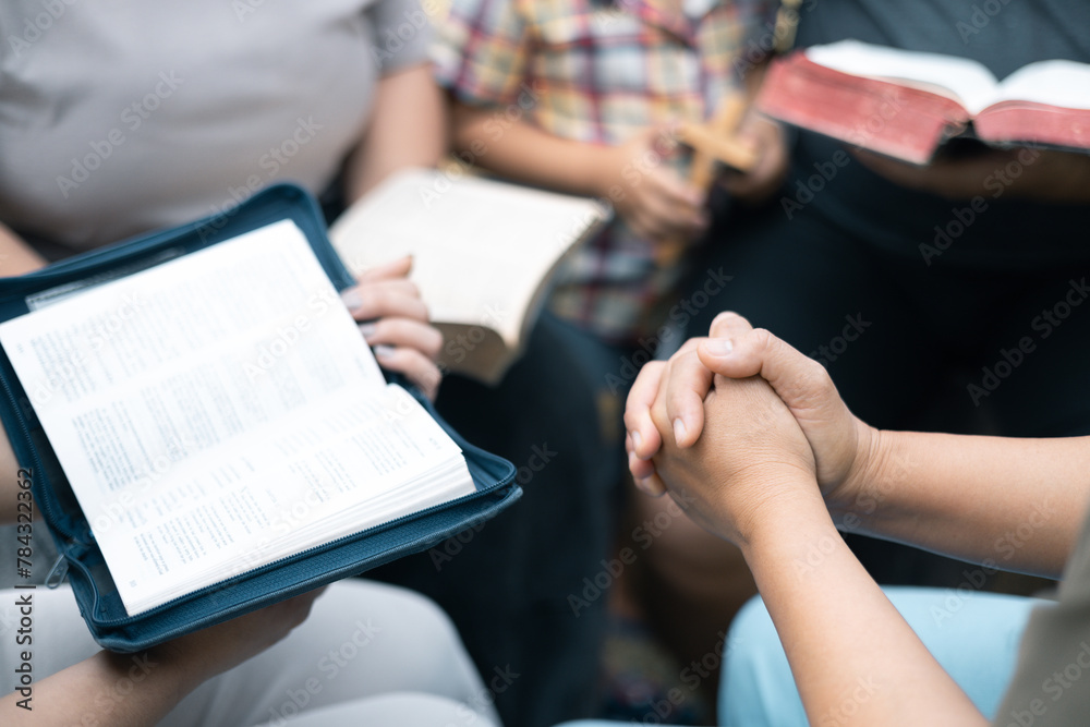 Christian woman held hands with the group, expressing their faith through prayer and devotion to God, uniting in their shared religion. Friends, Group christian pray concept. Christian woman held hands with the group, expressing their faith through prayer and devotion to God, uniting in their shared religion. Friends, Group christian pray concept.
