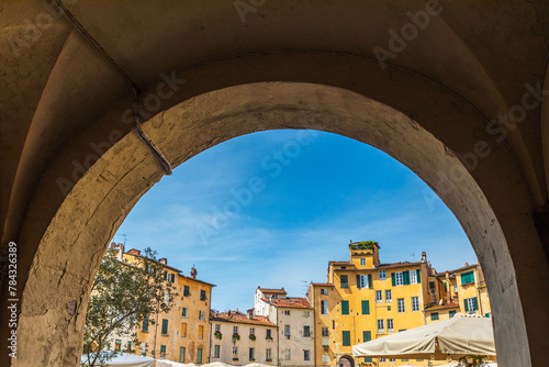 Lucca, Italy. View of Piazza dell'Anfiteatro square through the arch