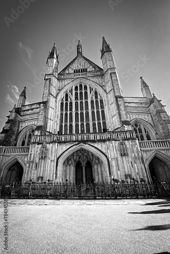 Vertical grayscale of the Winchester Cathedral in England with an empty entrance