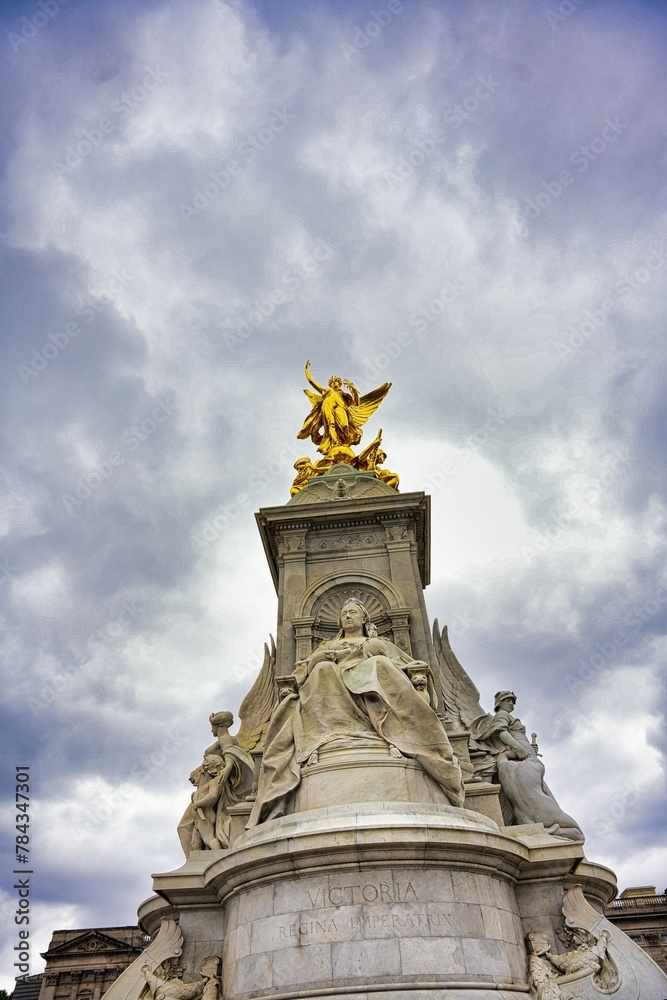 Low angle shot of Queen Victoria Memorial.Golden monument winged statue angel near Buckingham Palace