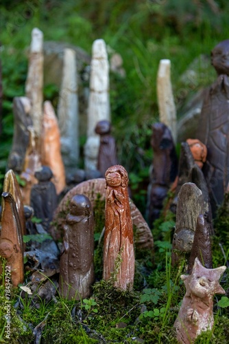 Vertical shot of small clay figures in the Shiststone town of Cadeira in Portugal photo