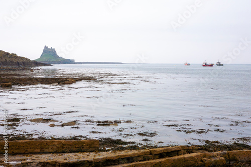 The castle and harbour from the Common, Lindisfarne, Holy Island, Northumberland, England, UK