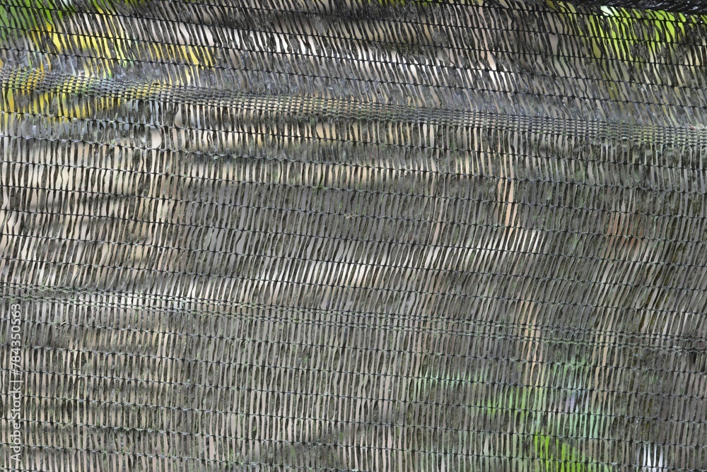 Gray net texture as a fence outside
