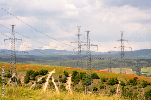 High voltage towers Electric pole. Power line support with wires for electricity transmission. High voltage grid tower with wire cable at distribution station. Energy industry, energy saving © svetograph