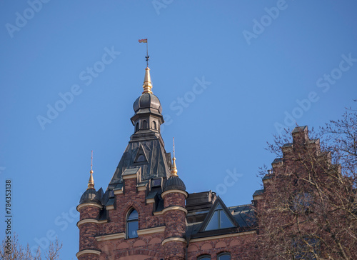 Old court house and the church tower of Storkyrkan in the island Gamla Stan a sunny spring evening in Stockholm