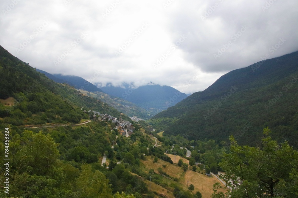 Scenic drone shot of forested mountains covered with clouds and mist, cool for background