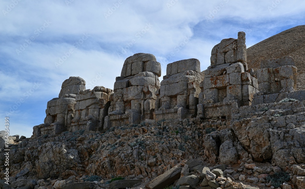 Ancient building on Mount Nemrut with a blue sky in the background in Turkey
