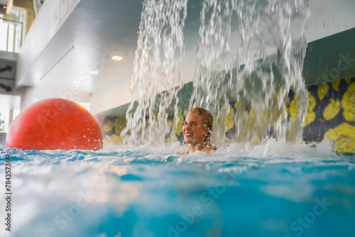 Young happy girl relaxing in the Rakvere spa pool. photo