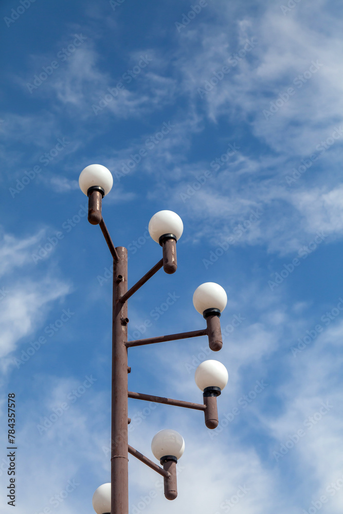 Street lamp on blue sky background with clouds Street lamp on blue sky background with clouds