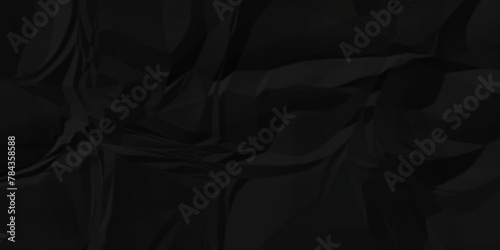 Dark black crumple paper wrinkled poster template ,blank glued creased paper texture background. black paper crumpled backdrop background. used for cardboard.