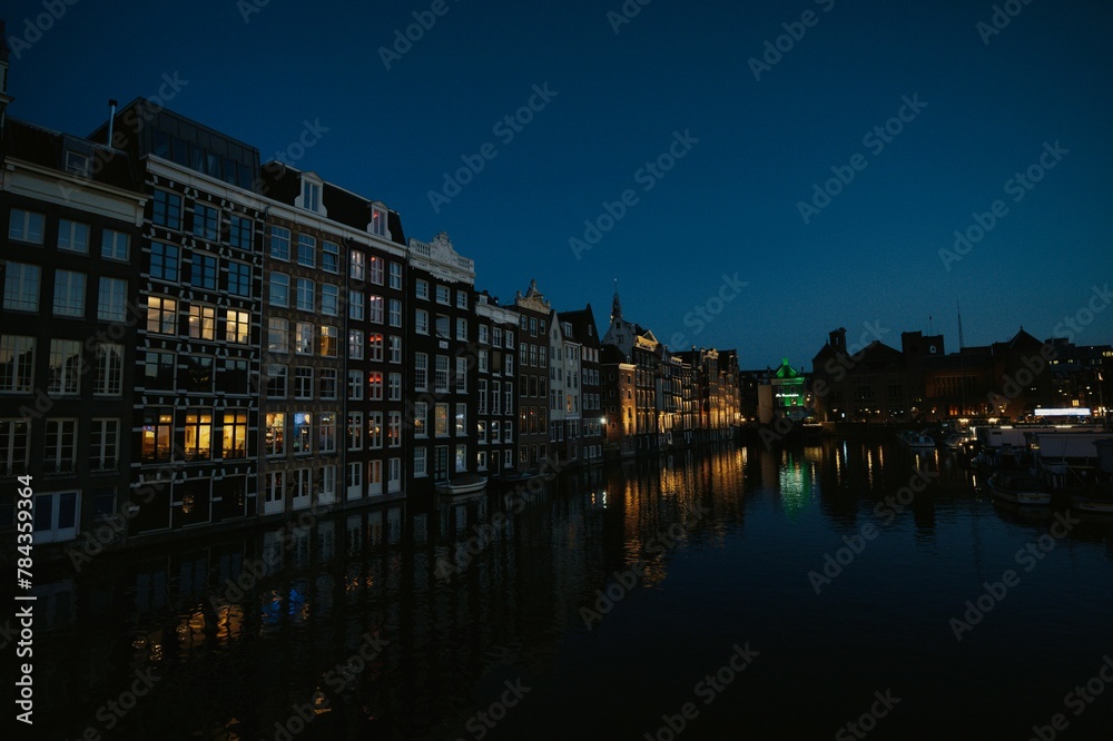 Scenic view of the beautiful architecture of the city of Amsterdam seen during nighttime