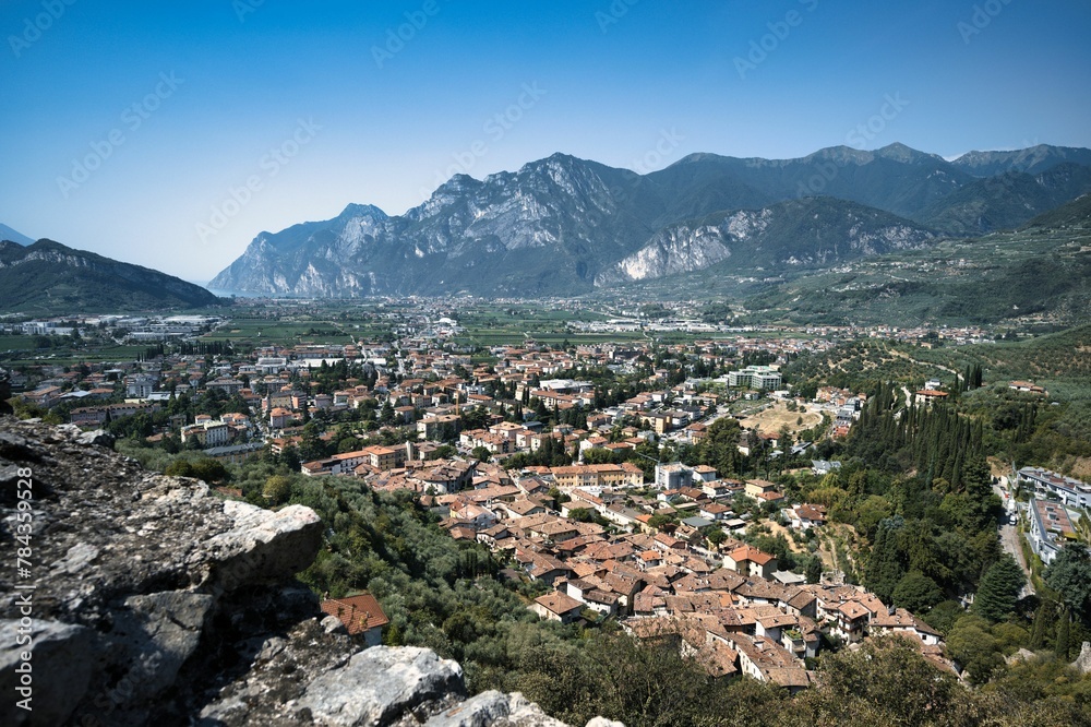 Landscape of buildings and hills in Limone sul Garda under a blue cloudy sky in Italy Landscape of buildings and hills in Limone sul Garda under a blue cloudy sky in Italy