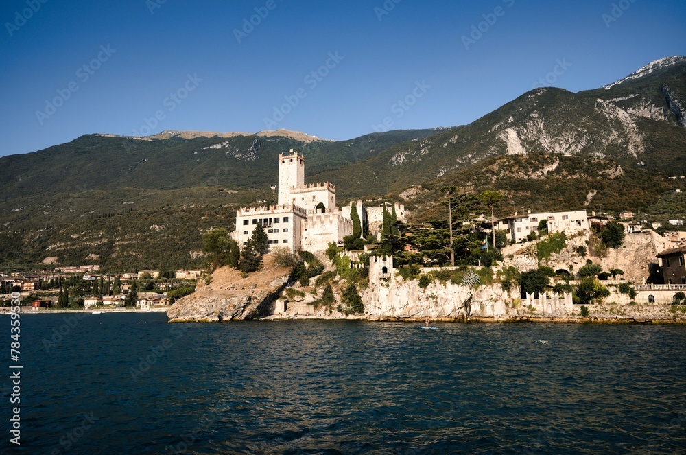 Landscape of Lake Garda surrounded by buildings and hills in Riva de Garda, Italy