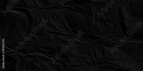 Dark black crumple paper wrinkled poster template ,blank glued creased paper texture background. black paper crumpled backdrop background. used for cardboard.