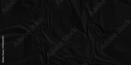 Dark black crumple paper wrinkled poster template ,blank glued creased paper texture background. black paper crumpled backdrop background. used for cardboard.