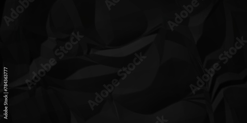 Dark black crumple paper wrinkled poster template ,blank glued creased paper texture background. black paper crumpled backdrop background. used for cardboard. photo