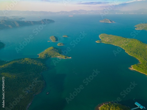 Drone shot of green-covered coasts of a sea, cool for background