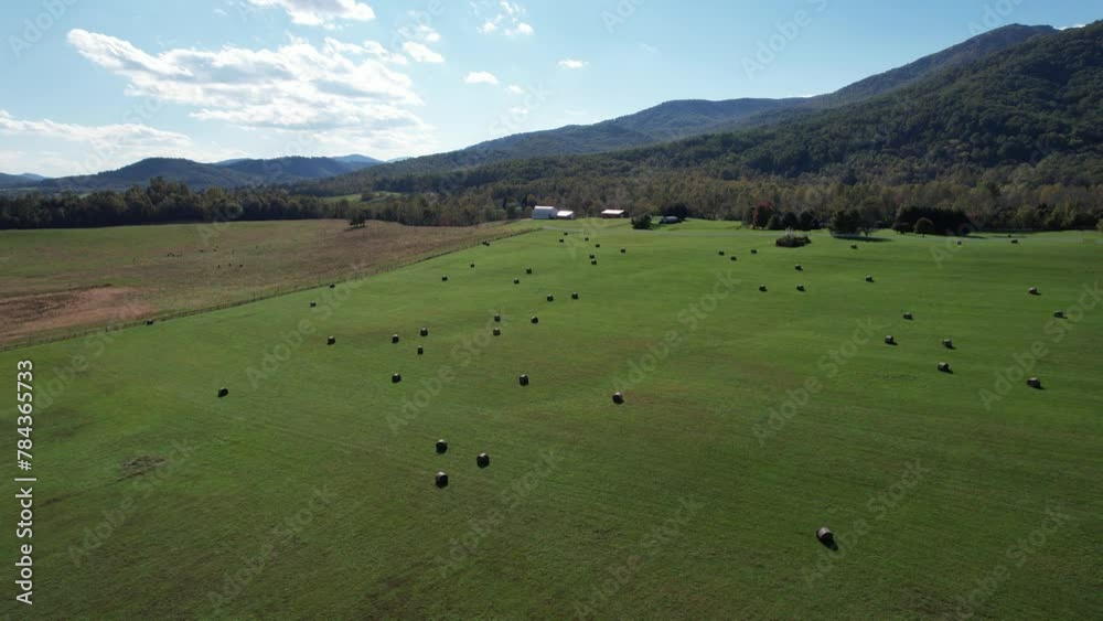 Aerial view of a green field in front of the Old Rag mountgin in Virginia Aerial view of a green field in front of the Old Rag mountgin in Virginia