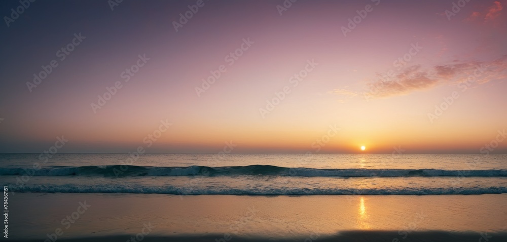 The sun sets over a peaceful beach, casting a warm glow on the tranquil waters and soft sandy shore at the golden hour.